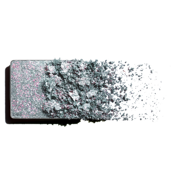 Makeup eyeshadow refill with pink and lilac pearl shimmer powder on a white background