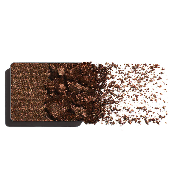 Makeup eyeshadow refill with rich chocolate powder on a white background