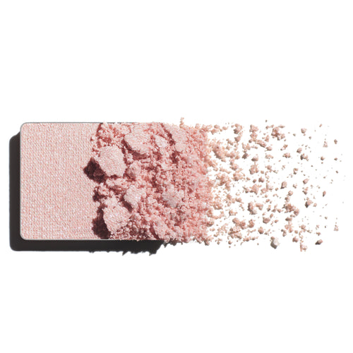 Makeup eyeshadow refill with ultraviolet pearl powder on a white background