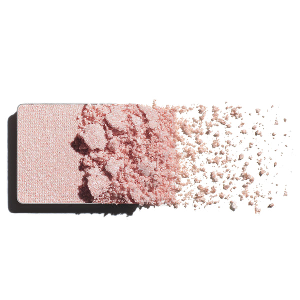 Makeup eyeshadow refill with ultraviolet pearl powder on a white background