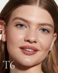 block The white pod packaging of Seamless Skin Enhancing Tint by Lisa Eldridge